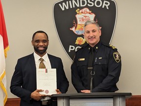 Windsor Police Chief Jason Bellaire (right) presents Const. Arjei Franklin with a St. John Ambulance Life-Saving Award on Tuesday, Jan. 24, 2023, for saving the life of a child who was not breathing.