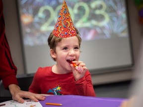 Jack McCullough, 3, celebrates an early New Year's Eve countdown at the Riverside Public Library where an early New Year's party was held for families with young children, on Saturday, Dec. 31, 2022.