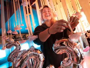 Kayla Lumley helps with New Year's Eve decorations at Turbo Espresso Bar, on Saturday, Dec. 31, 2022.