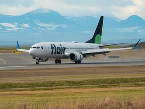 A Flair Airlines plane lands at Vancouver International Airpot (YVR) on Saturday, Dec. 31, 2022.