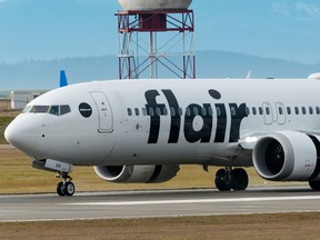 A Flair Airlines jet lands at Vancouver International Airpot (YVR) on Dec. 31, 2022.
