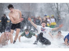 Staff and students at St. Clair College take part in a wintery slip n? slide for the campaign launch of the 9th Annual Polar Plunge Windsor-Essex, at St. Clair College, on Wednesday, Jan. 25, 2023.