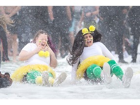 Staff and students at St. Clair College take part in a wintery slip n? slide for the campaign launch of the 9th Annual Polar Plunge Windsor-Essex, at St. Clair College, on Wednesday, Jan. 25, 2023.