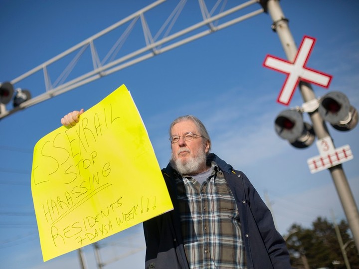  John West, a resident of South Walkerville, is pictured at the rail crossing on Kildare Road, on Tuesday, Jan. 31, 2023. West is upset with the Essex Terminal Railway for the increase in train whistles that he says disrupt his sleep.