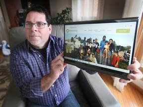 Mike Morency, executive director of Matthew House Refugee Welcome Centre in Windsor displays on Thursday, January 5, 2023 an image of refugees that were helped by the organization.