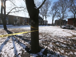 Police tape surrounds the scene of a townhouse fire near McDougall and Wyandotte on Tuesday, January 24, 2023.