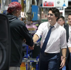 The Liberal government leader shook hands with many of the workers on the line Tuesday at the Windsor Assembly Plant.