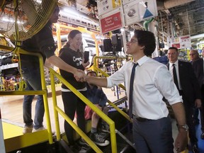 Autoworkers paused to shake hands or take photos of Prime Minister Justin Trudeau during his visit on Tuesday to the Windsor Assembly Plant.