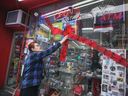 Ljubica Cajan, owner of Tunnel Discount Convenience, checks out damage to her store window on Thursday, January 12, 2023 in downtown Windsor.