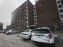 Windsor police vehicles sit in the parking lot of Wheelton Manor, a community housing building at 333 Glengarry Avenue in Windsor, on Jan. 10, 2023 - the day after a fatal stabbing in the area.