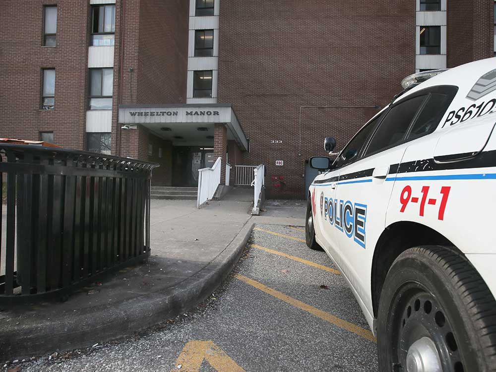 Windsor police vehicles sit in the parking lot of Wheelton Manor, a community housing building at 333 Glengarry Avenue in Windsor, on Jan. 10, 2023 - the day after a fatal stabbing in the area.