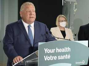 Ontario Premier Doug Ford, left, makes an announcement on health care in the province with Health Minister Sylvia Jones in Toronto, on Jan. 16.