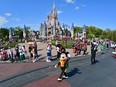 Mickey Mouse waves to fans during a parade at Walt Disney World Resort on March 3, 2022 in Lake Buena Vista, Fla.