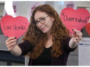 Misty Elliott of the Ypres Avenue branch of the Windsor Public Library holds up sarcastic hearts for the 'Anti-Valentine's Day' party she's organizing for teens on Feb. 11. Photographed Feb. 9, 2023.