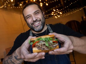 Adriano Ciotoli of WindsorEats displays the Burger Verde on Feb. 2, 2023. It's on the menu this month as part of the country-wide Burger It Forward campaign benefitting food banks.