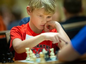 Josiah Drennan makes a move as he competes in the 23rd annual Windsor Chess Challenge at the Ciociaro Club, on Tuesday, Feb. 28, 2023.