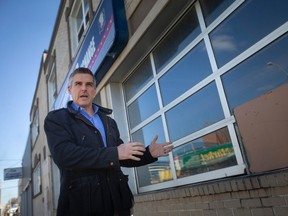 Rhys Trenhaile is pictured outside 493 University Avenue West, which he owns and is converting into a mix-use with six residential units, on Tuesday, Feb. 7, 2023.