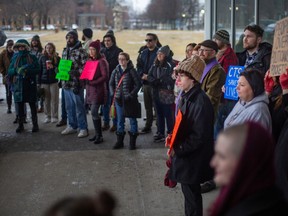 Supporters of the Safepoint CTS site hold a rally outside City Hall before the start of city council, on Monday, Feb. 27, 2023.