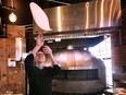 Cucina 360 owner Remo Tortola makes a pizza pie at the official opening of the Chatham Street West restaurant in downtown Windsor on Wednesday, February 8, 2023.