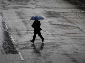 A pedestrian in downtown Windsor carries an umbrella in this February 2017 file photo.