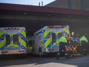 EMS paramedics bring a patient into Windsor Regional Hospital - Ouellette Campus on Tuesday, Feb. 7, 2023.