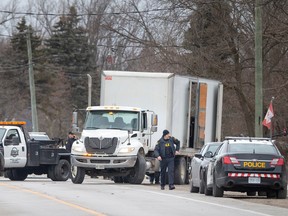 OPP investigators work at the scene of a fatal crash on County Road 34 West between Cottam and Essex on Feb. 7, 2023.