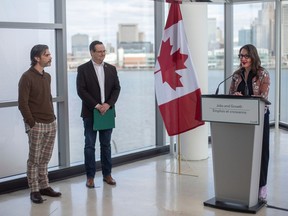 From left, Doug Sartori, of Windsor Hackforge, Irek Kusmierczyk, MP for Windsor-Tecumseh, and Jennifer Matotek, executive director of Art Windsor-Essex, hold a press conference on funding support of community infrastructure and tourism, at Art Windsor-Essex, on Friday, Feb. 24, 2023.