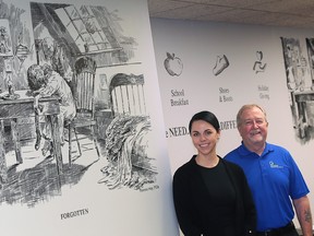Artist Carrina Domen recently completed a mural at the Windsor Goodfellows downtown office. She is shown with board member Steve Harrison on Wednesday, February 15, 2023 near the new artwork.