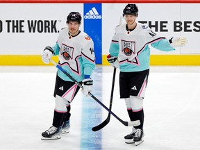 Pacific Division forward Bo Horvat (14) of the New York Islanders and Pacific Division forward Elias Pettersson (40) of the Vancouver Cannucks reacts after a play against the Central Division during the first period of a semifinal game during the 2023 NHL All-Star Game at FLA Live Arena. Sam Navarro-USA TODAY Sports