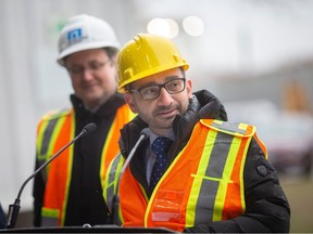 Minister of Transport, Omar Alghabra, is joined by MP Irek Kusmierczyk, left, during a press event at Morterm Limited announcing investment in ballast water programs, on Wednesday, Feb. 22, 2023.