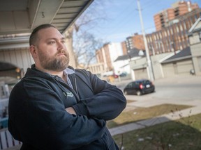 Downtown Windsor resident Nick Amlin keeps a watchful eye over his neighbourhood in the 800-900 block of Pelissier Street, near the Downtown Mission. Photographed Feb. 20, 2023.