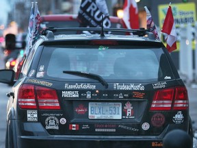 A protestor participating in a demonstration to mark the one year anniversary of the Ambassador Bridge blockade is shown on Sunday, February 5, 2023. Protestors chose the meet near a Matthew Good concert at the Olde Walkerville Theatre in Windsor.