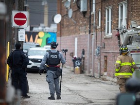 Windsor Police and Windsor Fire and Rescue are seen in the alley of 619 Pelissier St. for a police matter, on Thursday, Feb. 15, 2023.