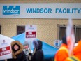 Striking workers at Windsor Salt form a picket line at the company property on Prospect Avenue on Feb. 17, 2023.