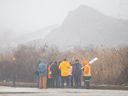 Staff at Windsor Salt, who own been on strike since closing Friday, are seen on the rail line where they prevented a educate from entering the Windsor Salt facility, on Thursday, Feb. 23, 2023.