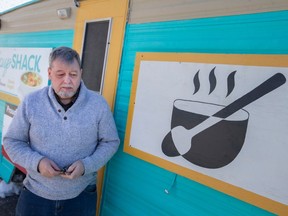 Roger Fordham, executive director and founder of Feeding Windsor Essex, stands next to the Soup Shack trailer where it is parked outside New Song Church, on Thursday, Feb. 2, 2023.