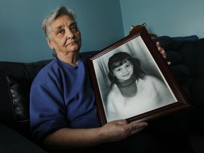 Paula Topic holds a portrait of her daughter Ljubica Topic, who was murdered in 1971, at her home in Windsor on Friday, April 17, 2015. Police have released the fact that a tooth was found at the scene of the murder in hopes someone will come forward with new information in the 44 year old case.