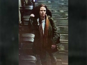 A surveillance camera image of an adult female suspect in the theft of a trumpet from a musical instrument store in Windsor.