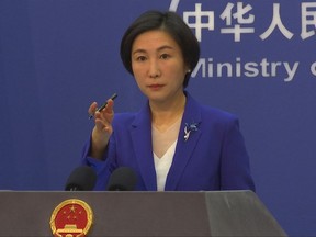 Chinese Foreign Ministry spokesperson Mao Ning gestures during a press conference at the Ministry of Foreign Affairs in Beijing, Oct 13, 2022.