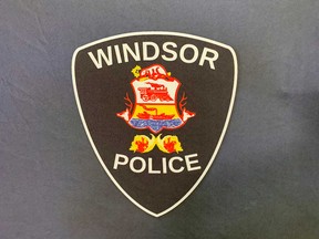 Windsor Police Service insignia on a backdrop at police headquarters in downtown Windsor.