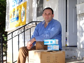 UFCW National representative Santiago Escobar prepares to hand out personal protective equipment outside the union's Agricultural Workers Support Centre in Leamington.