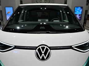 An ID Buzz van of German car giant Volkswagen (VW) is seen in the showroom during the company's annual press conference to present the business report, on March 14, 2023, in Berlin. Volkswagen is planning to invest 122 billion euros ($130 billion) in the shift towards electric vehicles over the coming years. (Photo by JOHN MACDOUGALL/AFP via Getty Images)