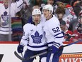 Maple Leafs left wing Michael Bunting (left) celebrates his goal with Noel Acciari during the third period against the Devils at Prudential Center in Newark, N.J., Tuesday, March 7, 2023.