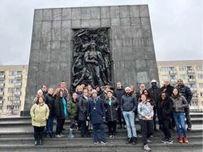 Participants in front of the monument commemorating the Warsaw Ghetto Uprising.