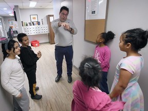 Mike Morency, executive director of Matthew House Refugee Welcome Centre in Windsor speaks with young residents of the facility on Tuesday, March 14, 2023.