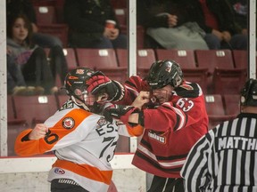 The Essex 73s' Conor Dembrinski, left, gets into a fight with Wallaceburg Thunderhawks' Logan Dobransky during Saturday's playoff game.