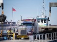 'Essential service.' A transport truck departs the Windsor-Detroit truck ferry in Windsor on Thursday, March 30, 2023.