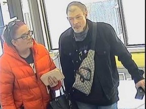 A security camera image of a female suspect and a male suspect who attempted fraudulent withdrawals from bank branches in Windsor on March 17, 2023.