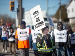 Back to work with new deal. In this Feb. 13, 2023, file photo, employees at Highbury Canco in Leamington are seen on the picket line on the first day of striking.