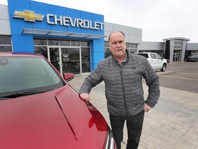 Financing remains a challenge to opening up the auto market more broadly to electric vehicles. Mickey Pierre, general manager of sales at Gus Revenberg Chevrolet Buick GMC, is shown at the Windsor dealership on Monday, March 27, 2023.